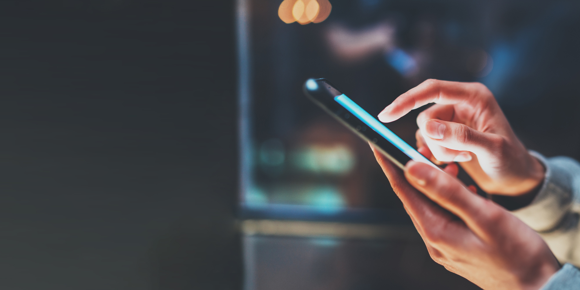 SEO, two hands holding mobile phone